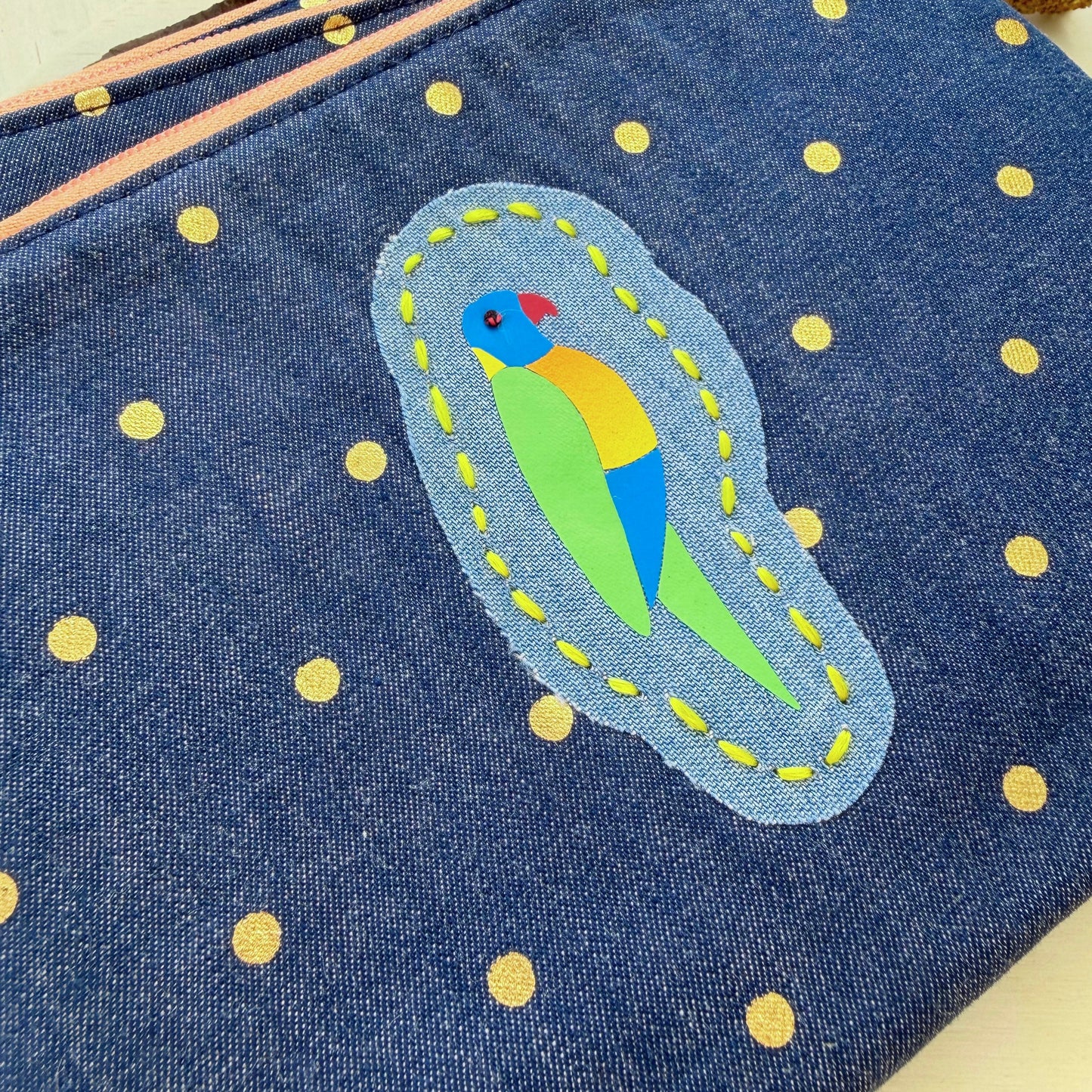 Handmade denim pouch with gold polkadots featuring colourful Rainbow Lorikeet designs and hand stitched detail