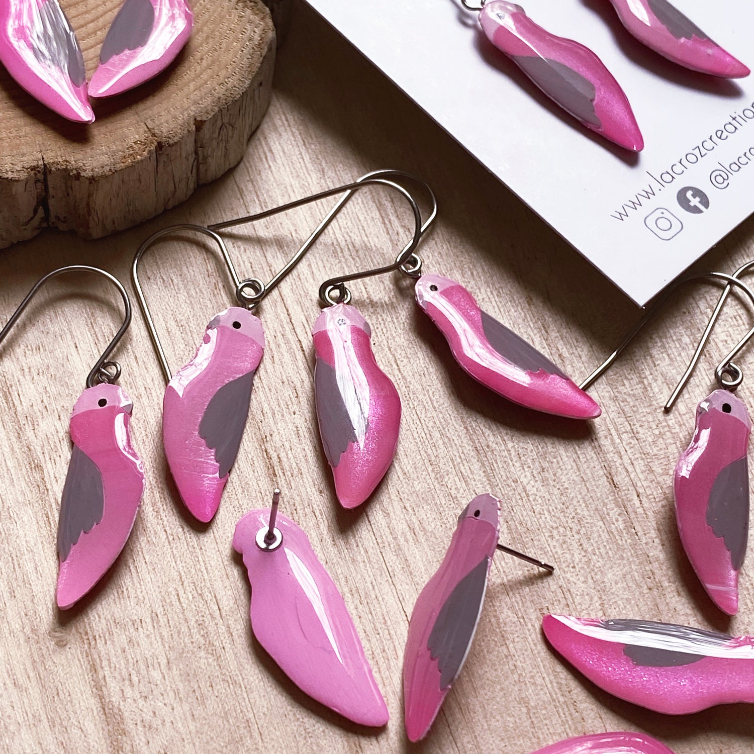 group of pink and grey australian galah earrings made from resin and acrylic paint