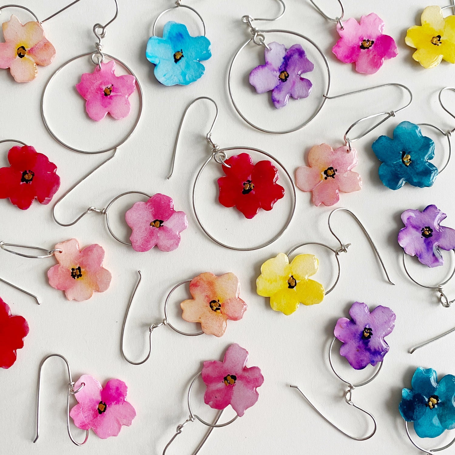 group of colourful hand painted watercolour floral dangle earrings