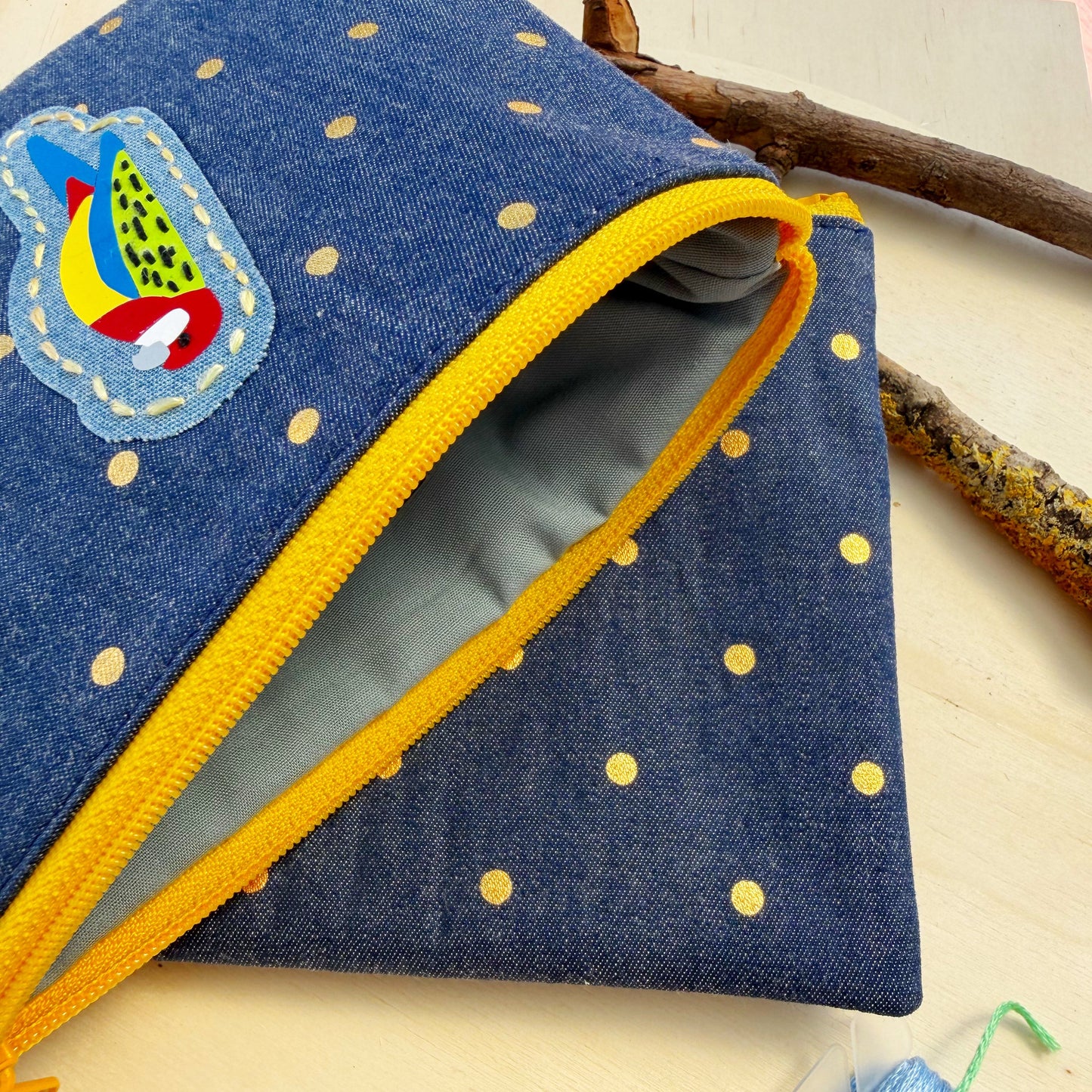 handmade zip pouch featuring Eastern Rosella bird design showing closeup of interior lining