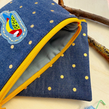 handmade zip pouch featuring Eastern Rosella bird design showing closeup of interior lining