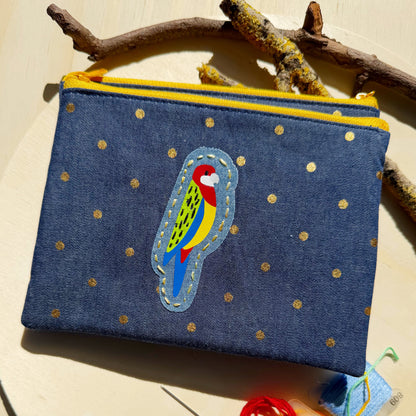 handmade zip pouch featuring eastern rosella bird design with handstitched details