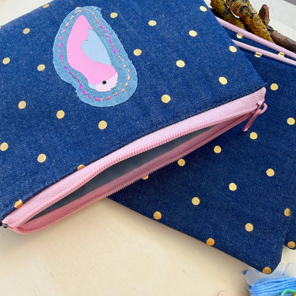 handmade blue denim pouch with gold polkadots featuring a galah applique and showing full lining
