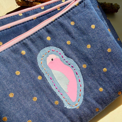 handmade blue denim pouch with gold polkadots featuring a galah and hand stiched embroidery detail