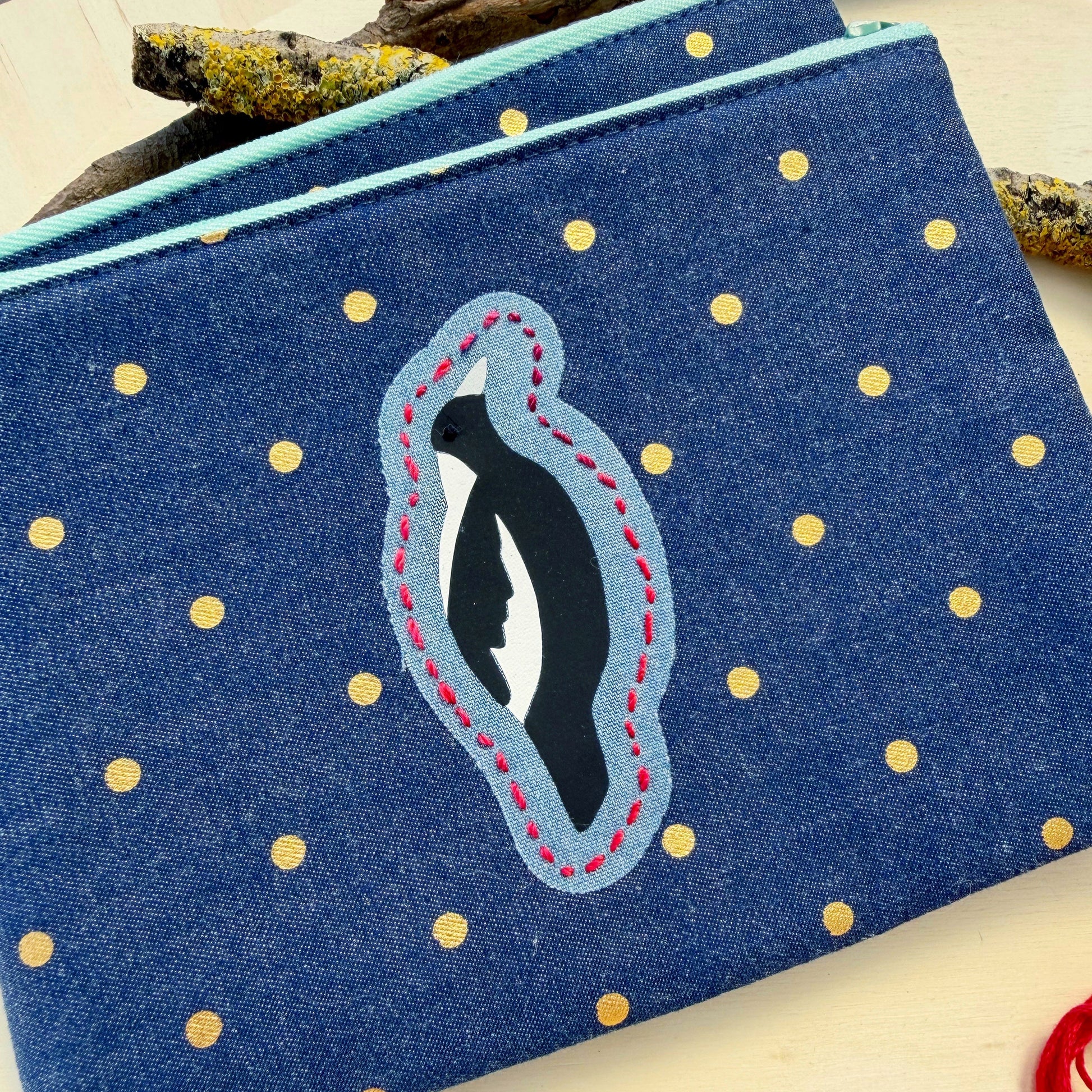 handmade zip pouch featuring Australian Magpie with handstitched details
