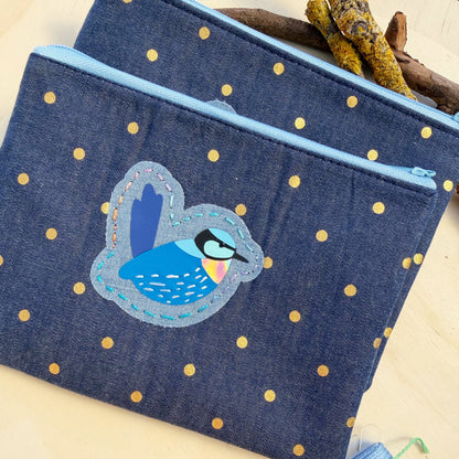 handmade zip pouch made from blue denim with gold polkadot material featuring bright blue splendid fairy wren