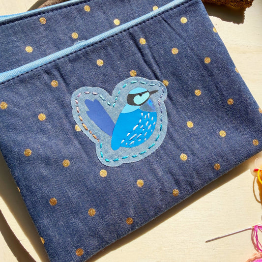 handmade blue denim with gold polkadots zip pouch featuring bright blue splendid fairy wren bird with embroidered detail
